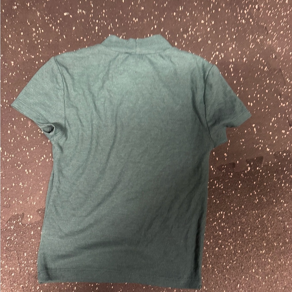 Women’s size small green slight turtleneck top.